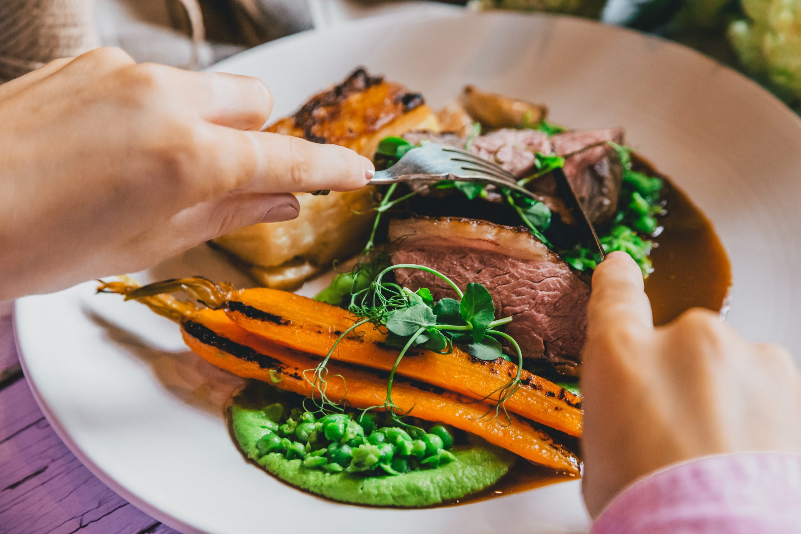 Lamb rump with pea purée, pot-roasted carrots and Dauphinoise potato